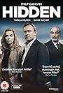 Philip Glenister, Thekla Reuten, and David Suchet in Hidden (2011)