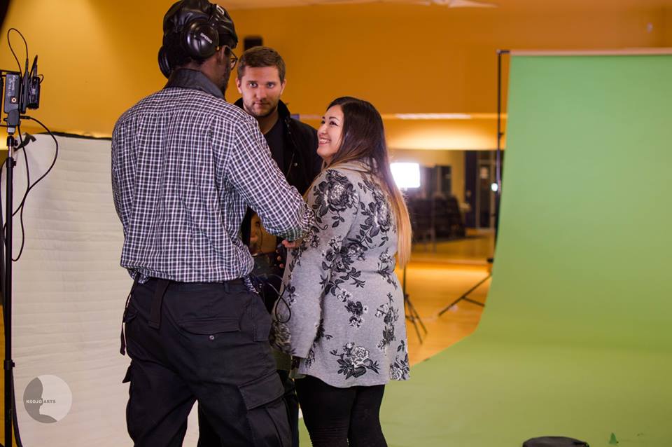 Gegel, DP Yazmin Ruiz, and director Kodjo Somana discuss a scene on set of "Programmed Series: Aznek" (2018).