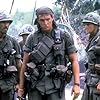 Tom Berenger, Ivan Kane, James Terry McIlvain, and Mark Moses in Platoon (1986)