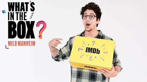 Milo Manheim unboxes his own career one magical handkerchief at a time. Watch the star of "School Spirits" and 'Z-O-M-B-I-E-S' pull candles, ukuleles, and more mysterious items out of a box full of personalized surprises. From reveling in the memory of his first IMDb credit to busting out an impromptu performance, see what happens when Milo Manheim finds out "What's in the Box."