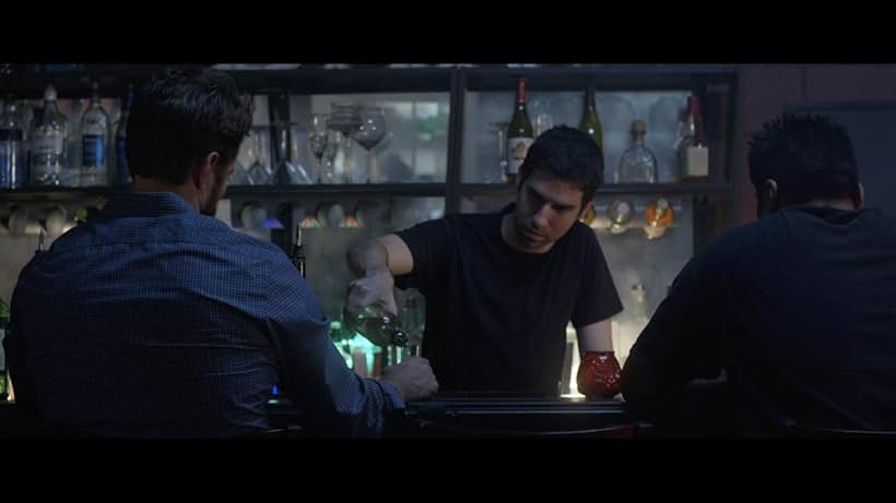 Screenshot from the film 'Still' as the bartender.