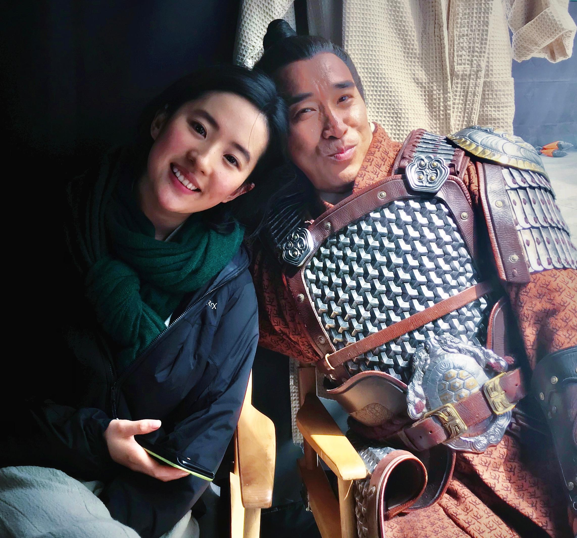 BTS still of Liu Yifei and Ron Yuan on the set of Disney’s “Mulan”