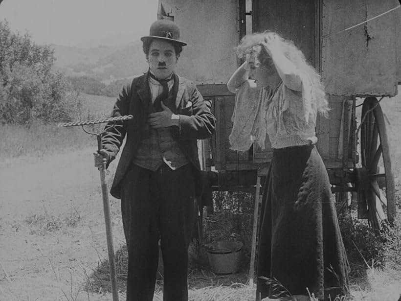 Charles Chaplin and Edna Purviance in The Vagabond (1916)