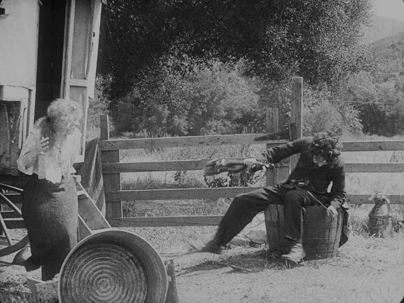 Charles Chaplin and Edna Purviance in The Vagabond (1916)