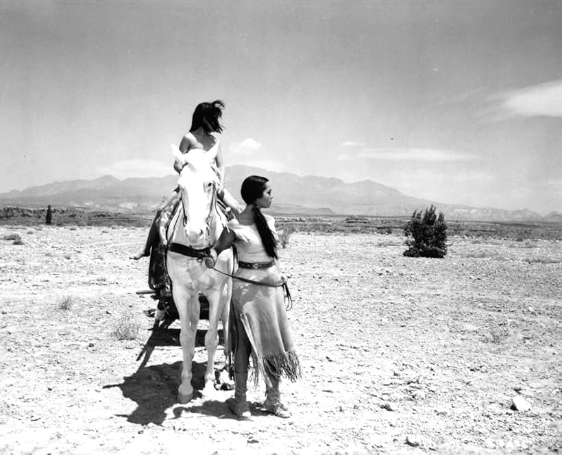 Billy Miller and Sara Montiel in Run of the Arrow (1957)