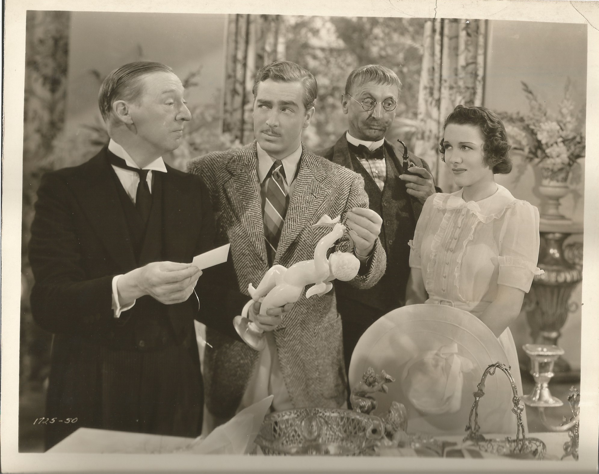 John Barrymore, Louise Campbell, E.E. Clive, and John Howard in Bulldog Drummond's Peril (1938)