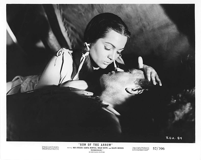 Rod Steiger and Sara Montiel in Run of the Arrow (1957)