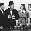 Robert Lowery, Sidney Toler, Marjorie Weaver, and Victor Sen Yung in Murder Over New York (1940)