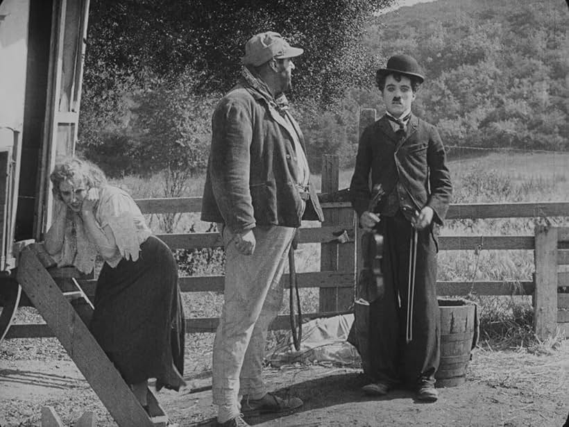 Charles Chaplin, Eric Campbell, and Edna Purviance in The Vagabond (1916)