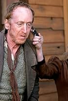 Larry Cedar and Paula Malcomson in Deadwood (2004)