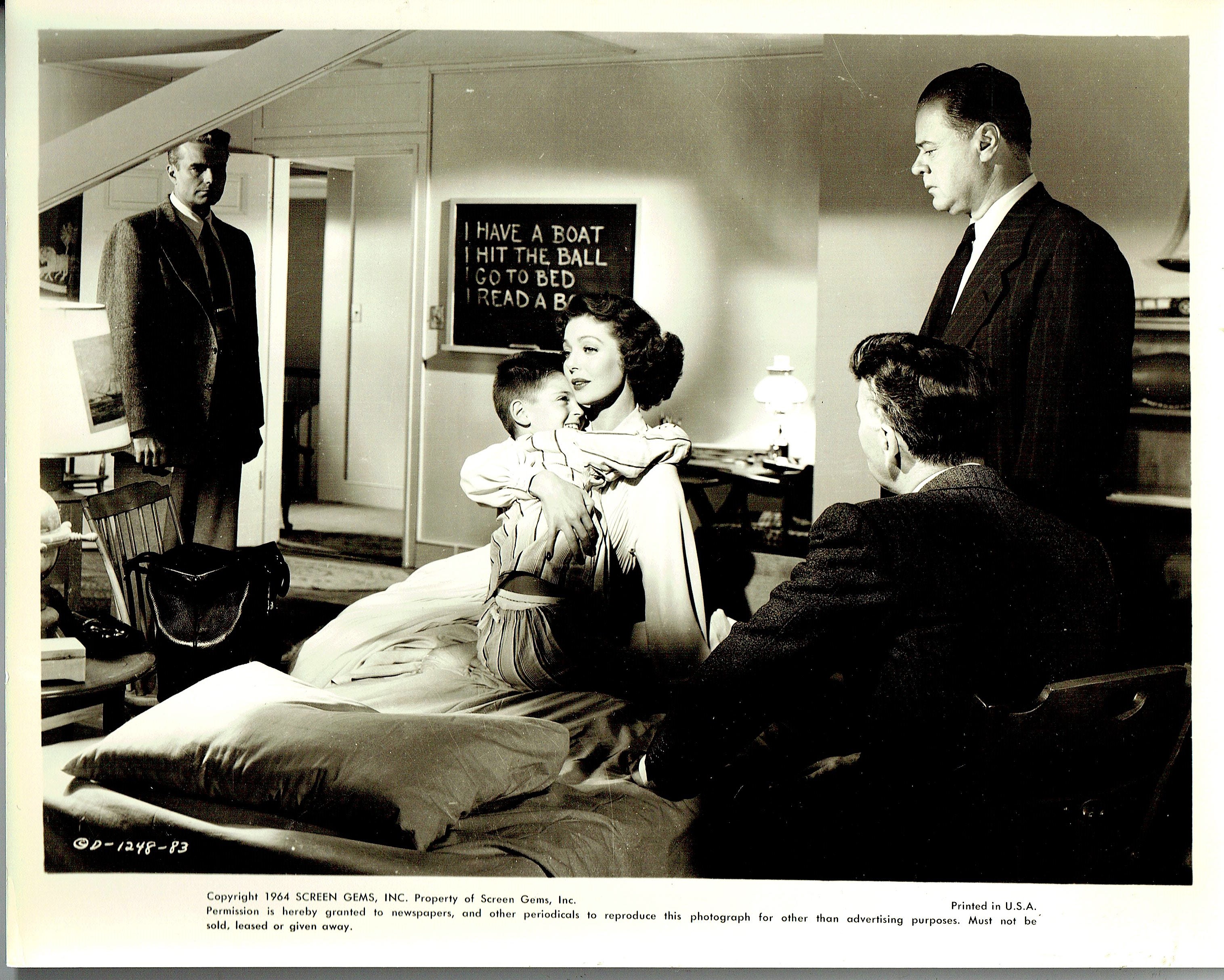 Tommy Rettig, Kent Smith, and Loretta Young in Paula (1952)