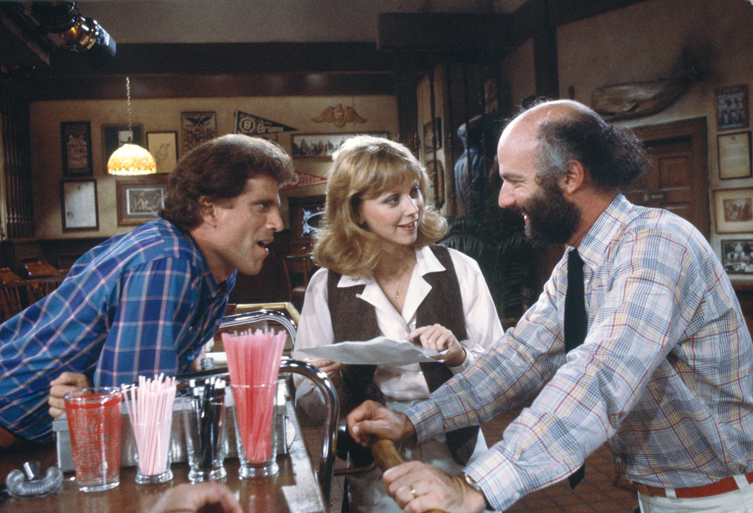 Ted Danson, Shelley Long, and James Burrows in Cheers (1982)