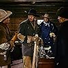 John Wayne, Jeffrey Hunter, Cliff Lyons, and Jack Pennick in The Searchers (1956)