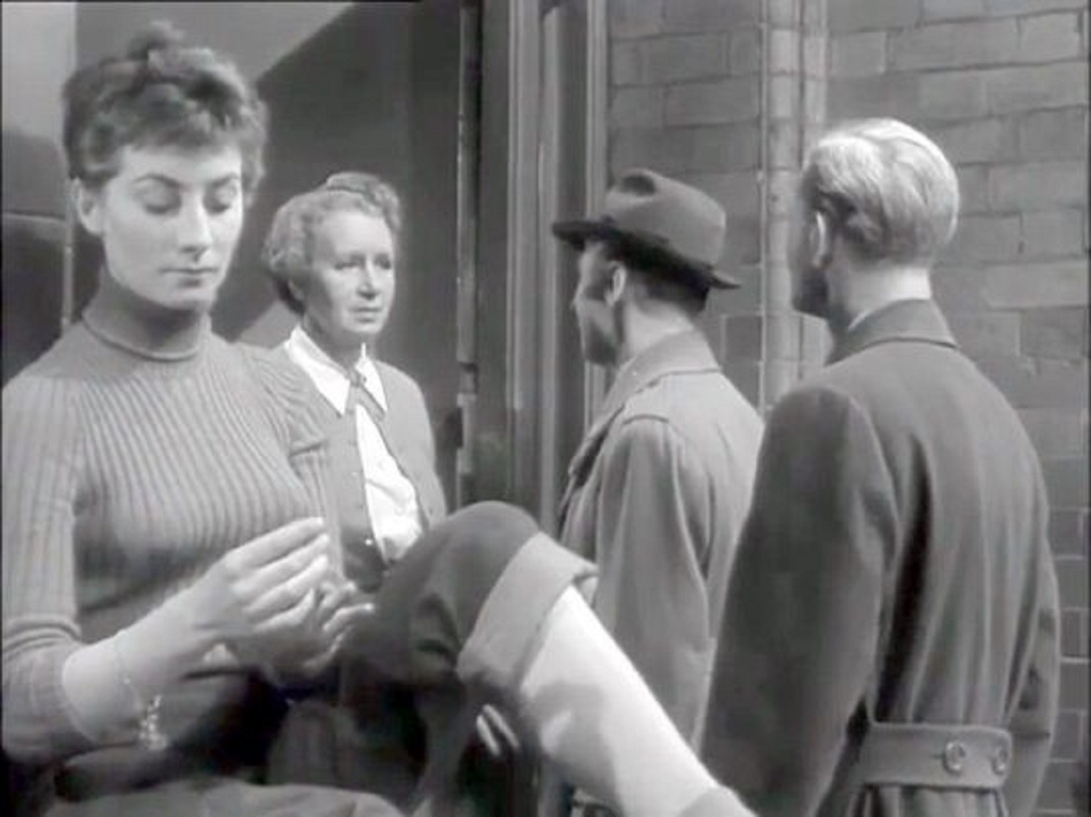 Marjorie Hume, Jean Marsh, Leslie Phillips, and Alan Wheatley in The Limping Man (1953)