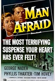 George Nader and Phyllis Thaxter in Man Afraid (1957)