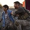 Chris Hemsworth and Rudhraksh Jaiswal in Extraction (2020)