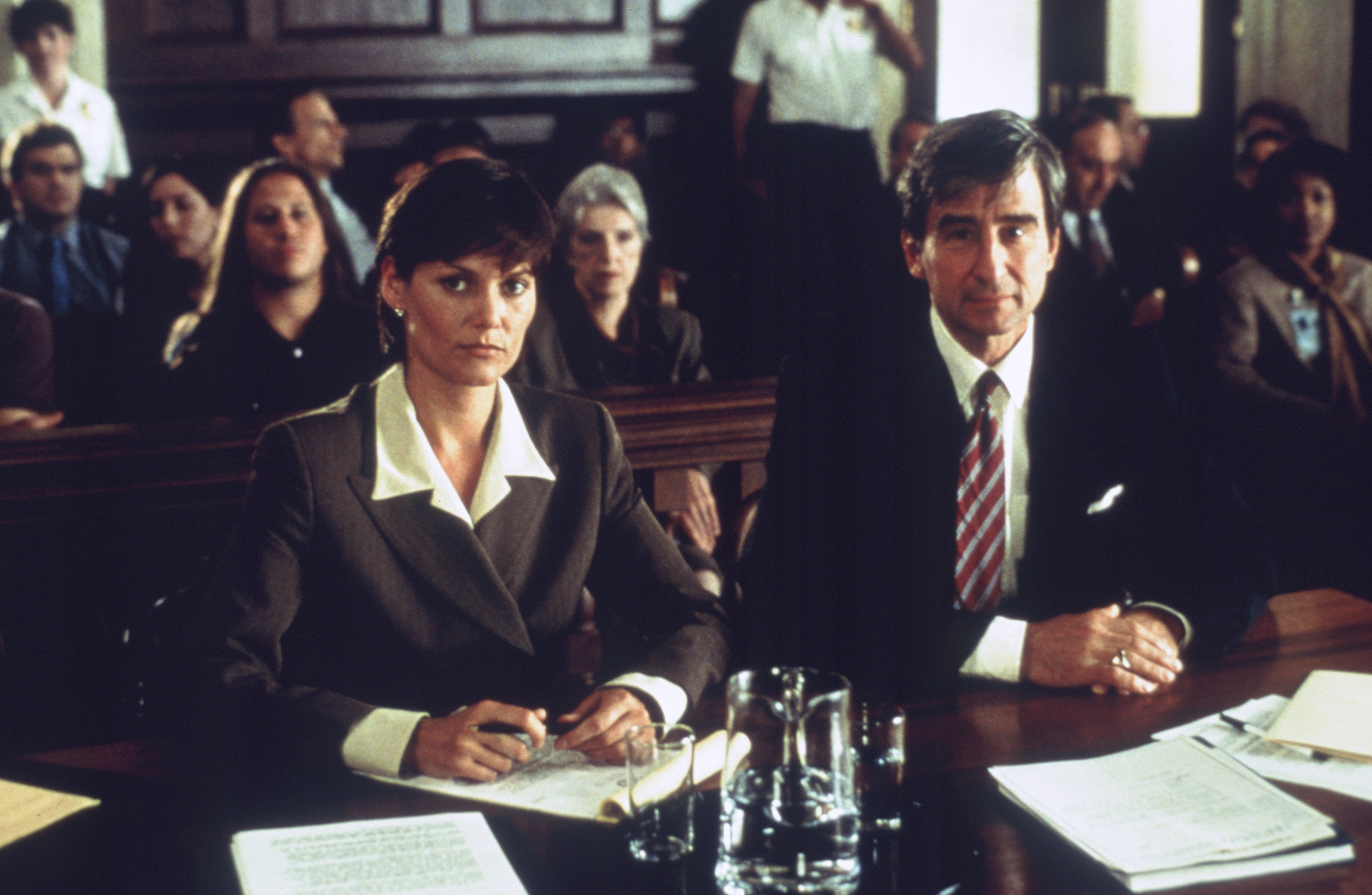 Carey Lowell and Sam Waterston in Law & Order (1990)