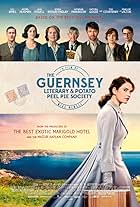 Tom Courtenay, Matthew Goode, Michiel Huisman, Penelope Wilton, Glen Powell, Katherine Parkinson, Jessica Brown Findlay, and Lily James in The Guernsey Literary and Potato Peel Pie Society (2018)