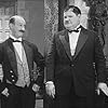 Oliver Hardy and James Finlayson in Chickens Come Home (1931)