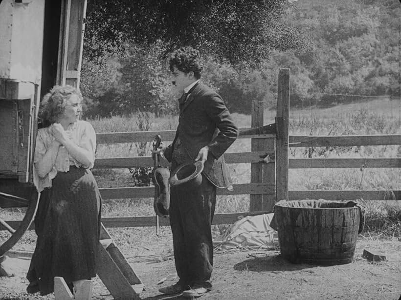 Charles Chaplin and Edna Purviance in The Vagabond (1916)