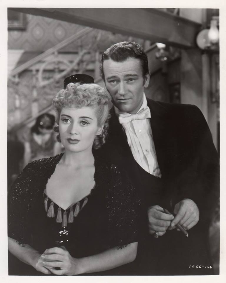 John Wayne and Joan Blondell in Lady for a Night (1942)