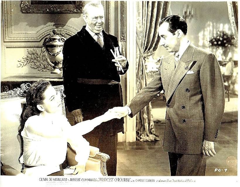 Olivia de Havilland, Charles Coburn, and Curt Bois in Princess O'Rourke (1943)