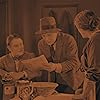 Marie Ault, Arthur Chesney, and Malcolm Keen in The Lodger: A Story of the London Fog (1927)