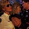 Leslie Easterbrook and Brian Tochi in Police Academy 3: Back in Training (1986)