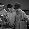 Moe Howard, Larry Fine, and Curly Howard in Men in Black (1934)