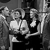 Veda Ann Borg, Doris Merrick, Arthur Space, and Frank Fenton in The Big Noise (1944)