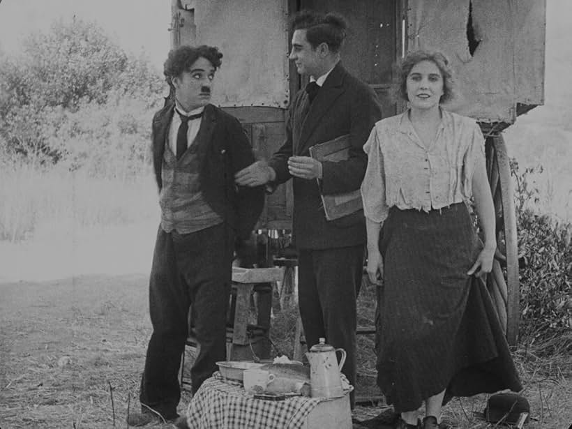 Charles Chaplin, Lloyd Bacon, and Edna Purviance in The Vagabond (1916)