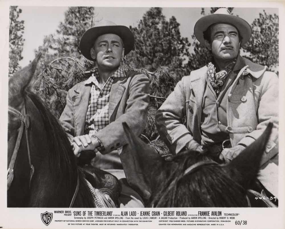 Alan Ladd and Gilbert Roland in Guns of the Timberland (1960)