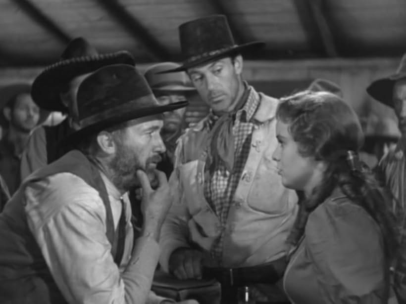 Gary Cooper, Walter Brennan, and Doris Davenport in The Westerner (1940)