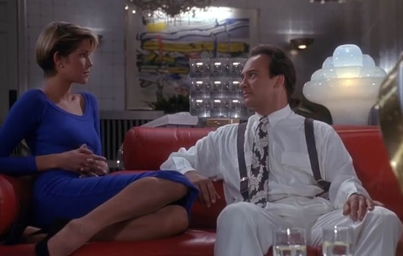 Jim Belushi and Loryn Locklin in Taking Care of Business (1990)