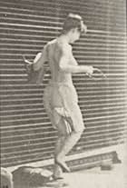 Woman Crossing Brook on Stepping-Stones with a Fishing Pole and a Can