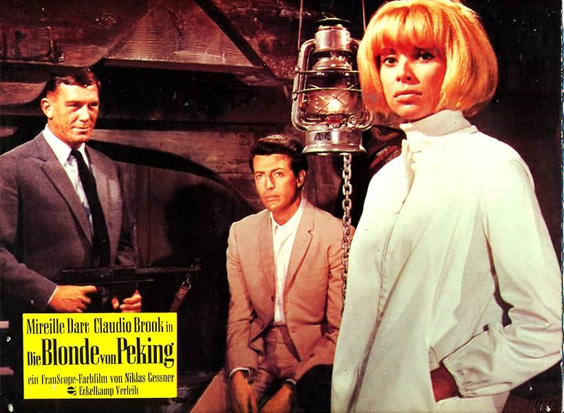 Mireille Darc and Claudio Brook in The Blonde from Peking (1967)