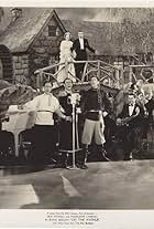 Madeleine Carroll, Dick Powell, Al Ritz, Harry Ritz, Jimmy Ritz, and The Ritz Brothers in On the Avenue (1937)