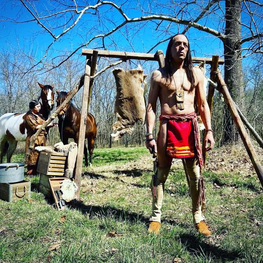 Marshall Dancing Elk as EQUA SAQUU and Erica Calhoun at the deer hide stand set of THE LEGEND OF BELLE STARR  (Photo by Sacha Thomas)