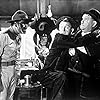 Oliver Hardy, Stan Laurel, and Edmund MacDonald in Great Guns (1941)