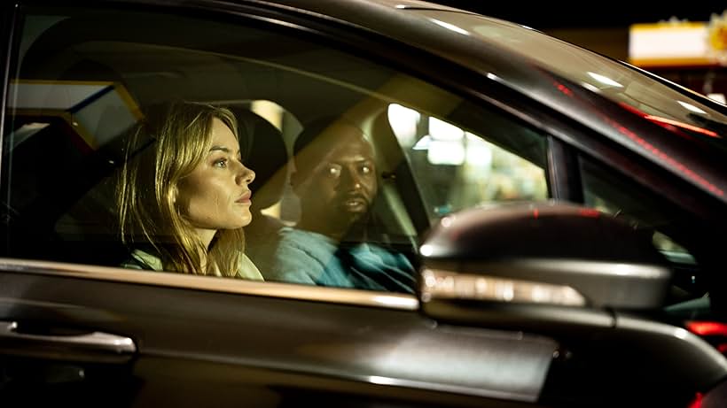 Camille Rowe and Jeremy Scippio in Night of the Hunted (2023)