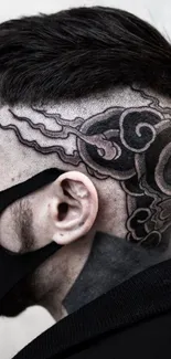 Side profile with intricate head tattoo design.