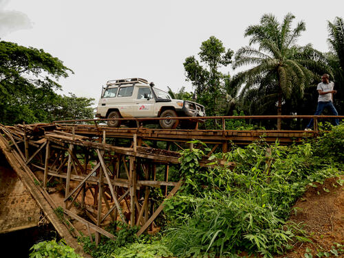 MSF Land Cruiser crossing a wooden bridge to reach a remote healthcare centre in Nigeria