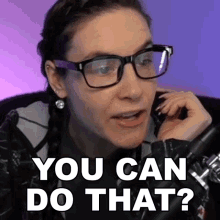 a woman wearing glasses talks into a microphone and says you can do that