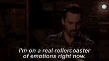 a man in a plaid shirt is saying i 'm on a real rollercoaster of emotions right now