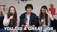 a group of people are sitting on a couch with microphones and the words you did a great job