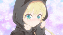 a girl with blonde hair wearing a black cat hoodie