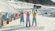 a group of people standing on a snowy mountain with the words happy birthday below them