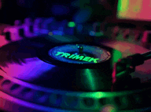 a trimek turntable with a record spinning on it