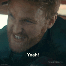 a man with a beard is making a face and says yeah .