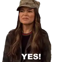 a woman wearing a camouflage hat and a jacket says yes
